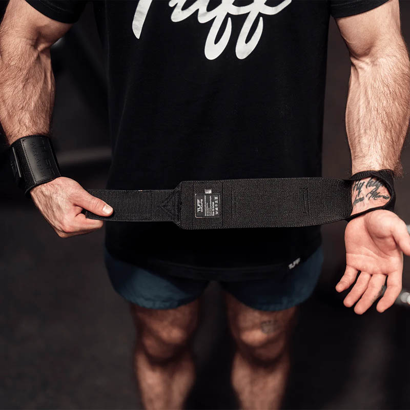 Lifter demonstrating the length and fit of Blackout Villain wrist wraps